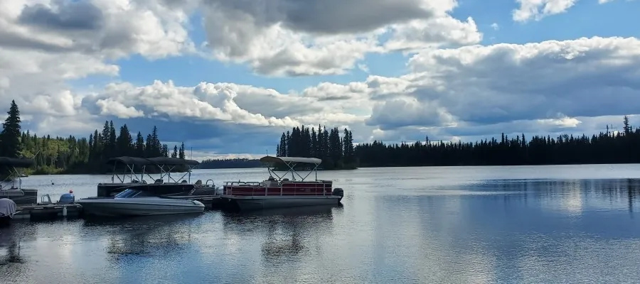 Boats at the dock under a big sky